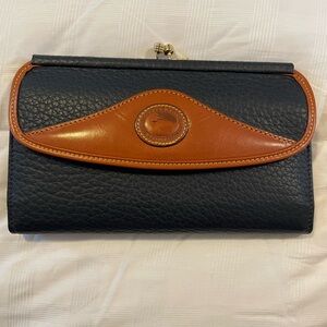 Dooney and Bourke vintage wallet. 7 1/4” wide. Beautiful condition.